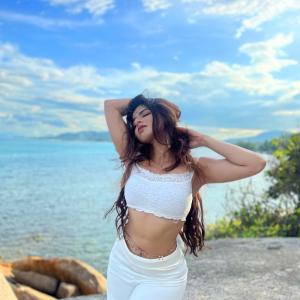 Actress Ishwarya Menon Radiates Elegance in All-White Beach Look | Summer Fashion Vibes