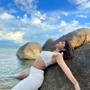 Actress Ishwarya Menon Radiates Elegance in All-White Beach Look | Summer Fashion Vibes