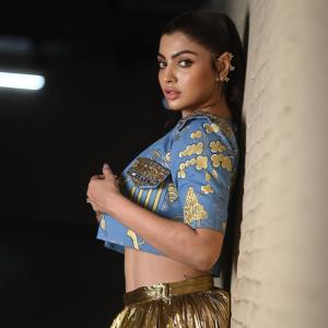 Actress Akanksha Puri Shines in Gold Pleated Skirt – Stunning Fusion Look