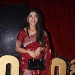 Actress Varsha Bolamma Stuns in Maroon Silk Saree at  Red Carpet Event