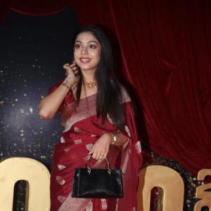 Actress Varsha Bolamma Stuns in Maroon Silk Saree at  Red Carpet Event