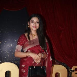Actress Varsha Bolamma Stuns in Maroon Silk Saree at  Red Carpet Event