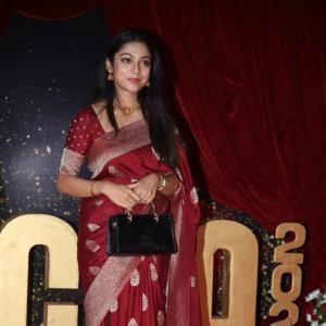 Actress Varsha Bolamma Stuns in Maroon Silk Saree at  Red Carpet Event