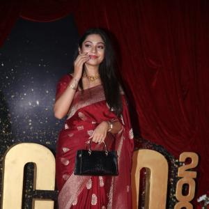 Actress Varsha Bolamma Stuns in Maroon Silk Saree at  Red Carpet Event