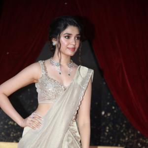 Actress Kriti Shetty Dazzles in Golden Saree at Event
