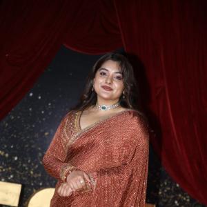 Actress Nivetha Thomas Glows in Maroon Saree at Grand Red Carpet Event