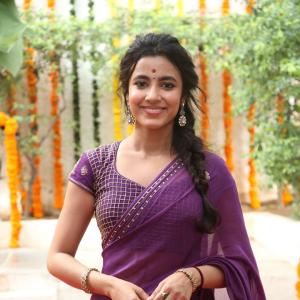 Actress Shivani Nagaram Glows in Traditional Purple Saree at Festive Event