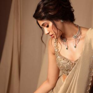 Actress Kriti Shetty Stunning in Beige Saree with Elegant Silver Embellishments - Fashion & Beauty