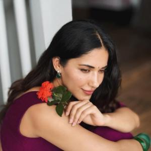 Ruhani Sharma Looks Graceful in Wine-Colored Saree with Floral Charm