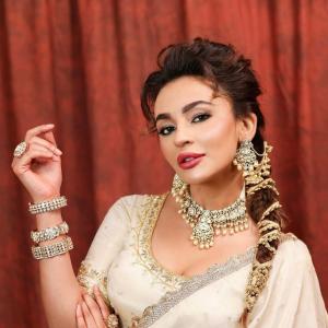 Seerat Kapoor Dazzles in Ivory and Green Banarasi Lehenga Look