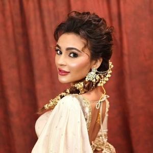 Seerat Kapoor Dazzles in Ivory and Green Banarasi Lehenga Look