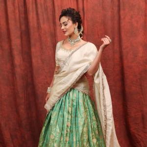 Seerat Kapoor Dazzles in Ivory and Green Banarasi Lehenga Look