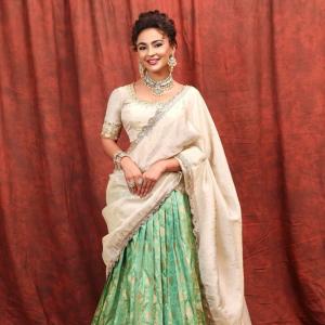Seerat Kapoor Dazzles in Ivory and Green Banarasi Lehenga Look