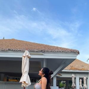 Ruhani Sharma Embraces Tropical Vibes in Halter Top and Green Skirt