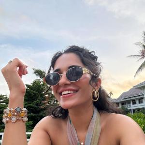 Ruhani Sharma Embraces Tropical Vibes in Halter Top and Green Skirt
