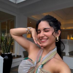 Ruhani Sharma Embraces Tropical Vibes in Halter Top and Green Skirt