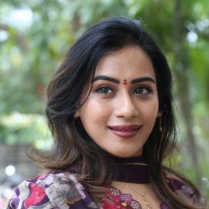 Preeti Sunder Elegant Floral Purple Outfit with Traditional Jewelry