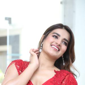 Nidhhi Agerwal Dazzles in Elegant Red Saree with Embroidered Blouse