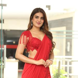 Nidhhi Agerwal Dazzles in Elegant Red Saree with Embroidered Blouse