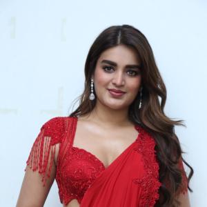Nidhhi Agerwal Dazzles in Elegant Red Saree with Embroidered Blouse
