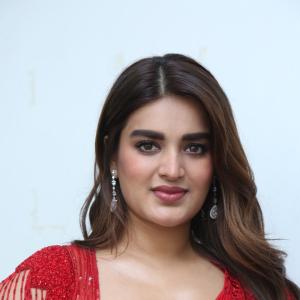 Nidhhi Agerwal Dazzles in Elegant Red Saree with Embroidered Blouse