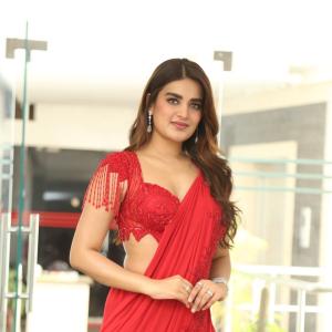 Nidhhi Agerwal Dazzles in Elegant Red Saree with Embroidered Blouse