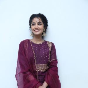 Anupama Parameswaran Looks Elegant in Maroon Anarkali Suit with Traditional Jhumkas