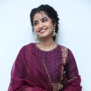 Anupama Parameswaran Looks Elegant in Maroon Anarkali Suit with Traditional Jhumkas