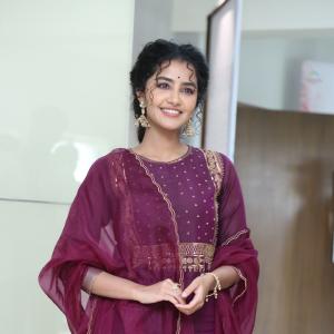 Anupama Parameswaran Looks Elegant in Maroon Anarkali Suit with Traditional Jhumkas