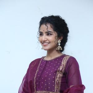 Anupama Parameswaran Looks Elegant in Maroon Anarkali Suit with Traditional Jhumkas