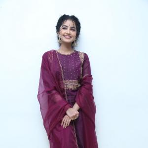 Anupama Parameswaran Looks Elegant in Maroon Anarkali Suit with Traditional Jhumkas