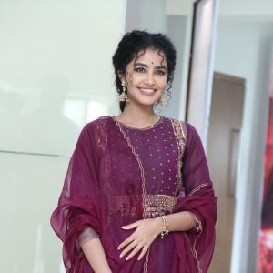 Anupama Parameswaran Looks Elegant in Maroon Anarkali Suit with Traditional Jhumkas
