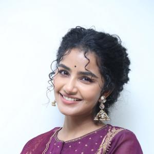 Anupama Parameswaran Looks Elegant in Maroon Anarkali Suit with Traditional Jhumkas