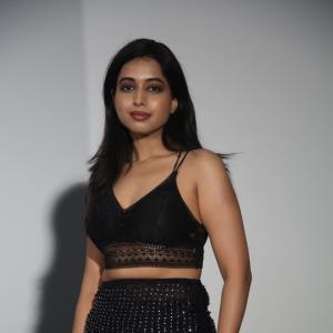Ritika Chakravarthy Stunning Look in Black Lace Crop Top and Shimmering Skirt at Fashion Event