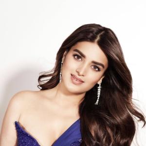 Nidhhi Agerwal Exudes Elegance in a Blue Beaded Gown