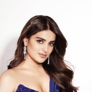Nidhhi Agerwal Exudes Elegance in a Blue Beaded Gown