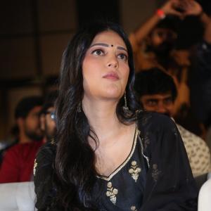 Shruti Haasan Graces Event in Traditional Black Attire with Intricate Gold Embroidery