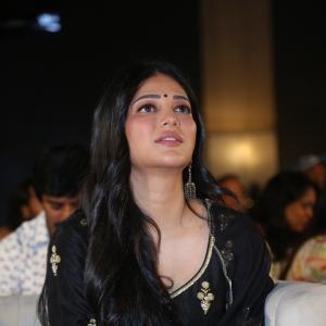 Shruti Haasan Graces Event in Traditional Black Attire with Intricate Gold Embroidery