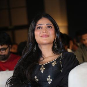 Shruti Haasan Graces Event in Traditional Black Attire with Intricate Gold Embroidery