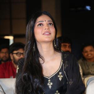 Shruti Haasan Graces Event in Traditional Black Attire with Intricate Gold Embroidery