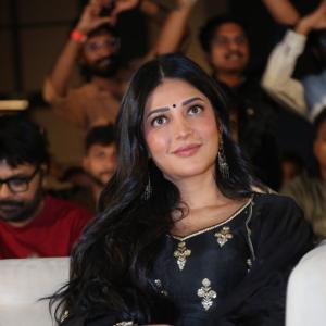 Shruti Haasan Graces Event in Traditional Black Attire with Intricate Gold Embroidery