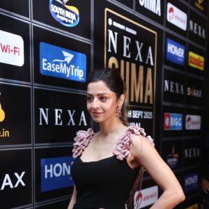 Elegant Woman in Black Dress at Glamorous Event | Red Carpet Fashion