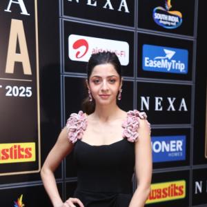 Elegant Woman in Black Dress at Glamorous Event | Red Carpet Fashion