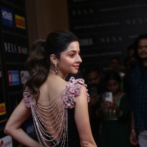 Elegant Woman in Black Dress at Glamorous Event | Red Carpet Fashion