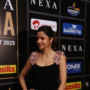 Elegant Woman in Black Dress at Glamorous Event | Red Carpet Fashion