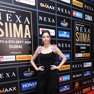 Elegant Woman in Black Dress at Glamorous Event | Red Carpet Fashion