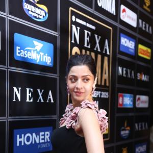 Elegant Woman in Black Dress at Glamorous Event | Red Carpet Fashion