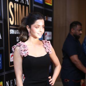 Elegant Woman in Black Dress at Glamorous Event | Red Carpet Fashion