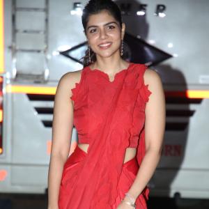 Kalyani Priyadarshan Stuns in Red Saree at Event – Elegant and Graceful Look