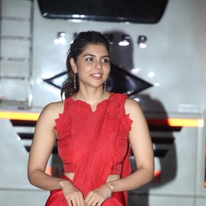 Kalyani Priyadarshan Stuns in Red Saree at Event – Elegant and Graceful Look